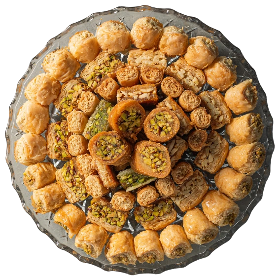 An assortment of golden baklava and pistachio sweets